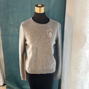 Zodiac (Cancer) design 100% Merino Wool sweater in light grey.